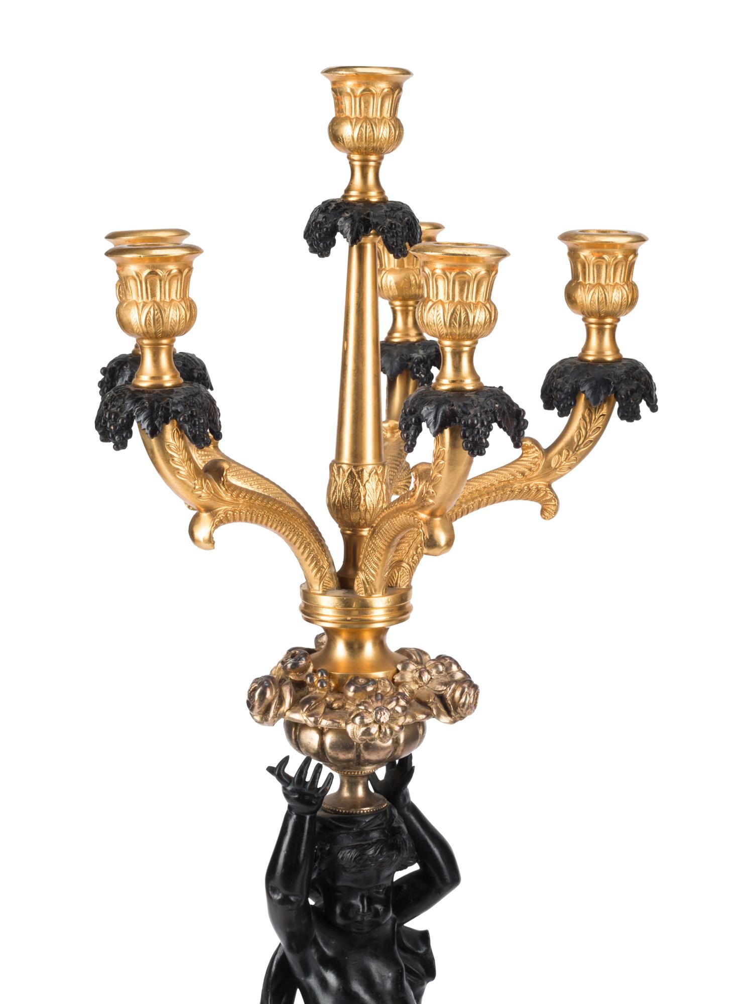 A Pair of French Gilt and Patinated Bronze Figural Six-Light Candelabra