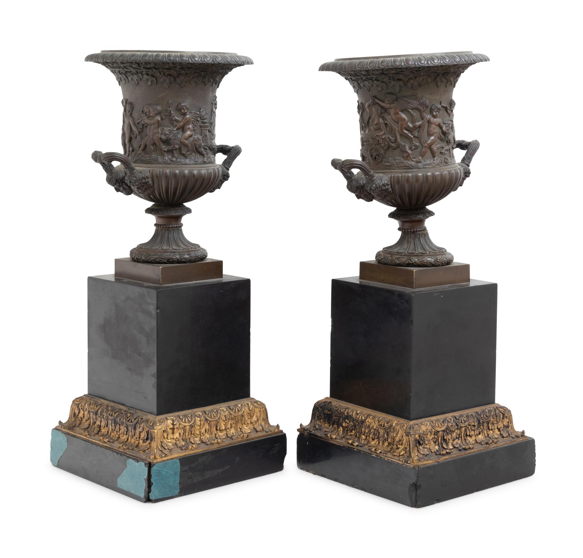 A Pair of Continental Bronze Urns with Associated Plinths