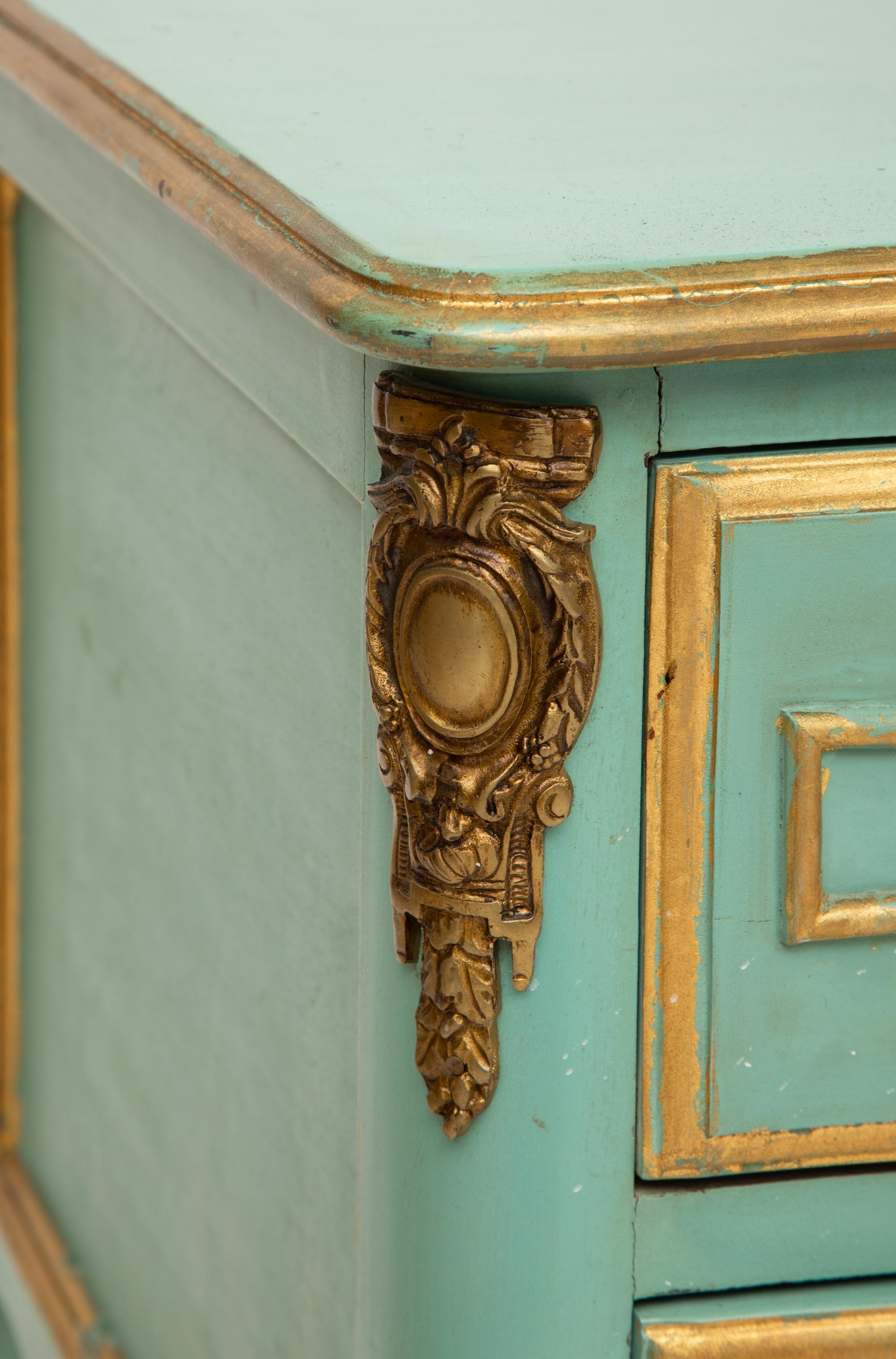 A Louis XV Style Painted and Parcel Gilt Commode