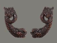 A Pair of Carved Mahogany Dolphin Brackets