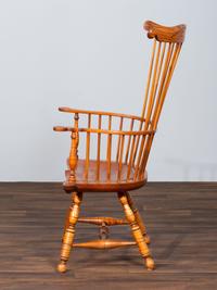 A D.R. Dimes Benchmark Turned and Volute Carved Tiger Maple and Pine Comb-Back Windsor Armchair