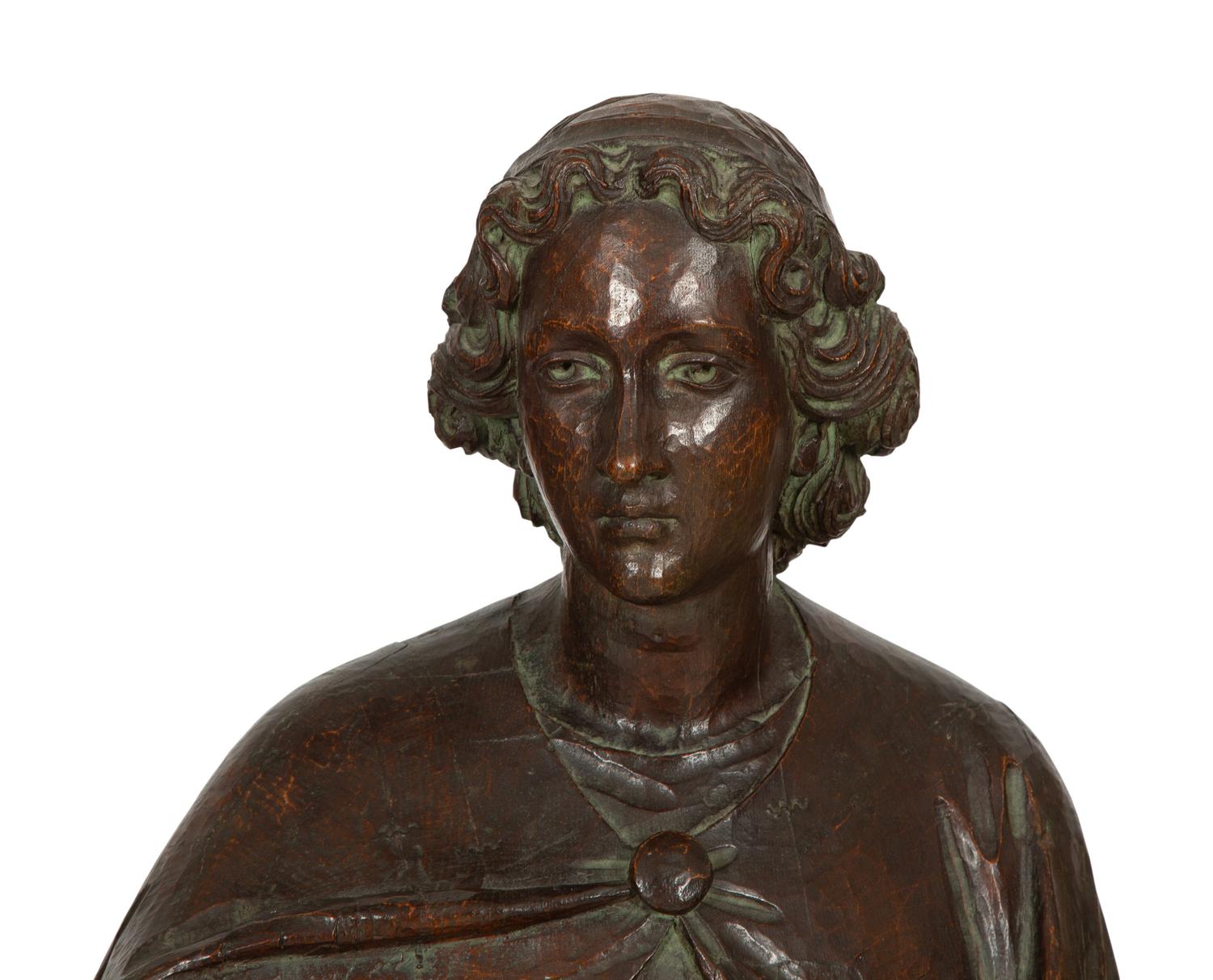 A Continental Carved Oak Figure of a Saint