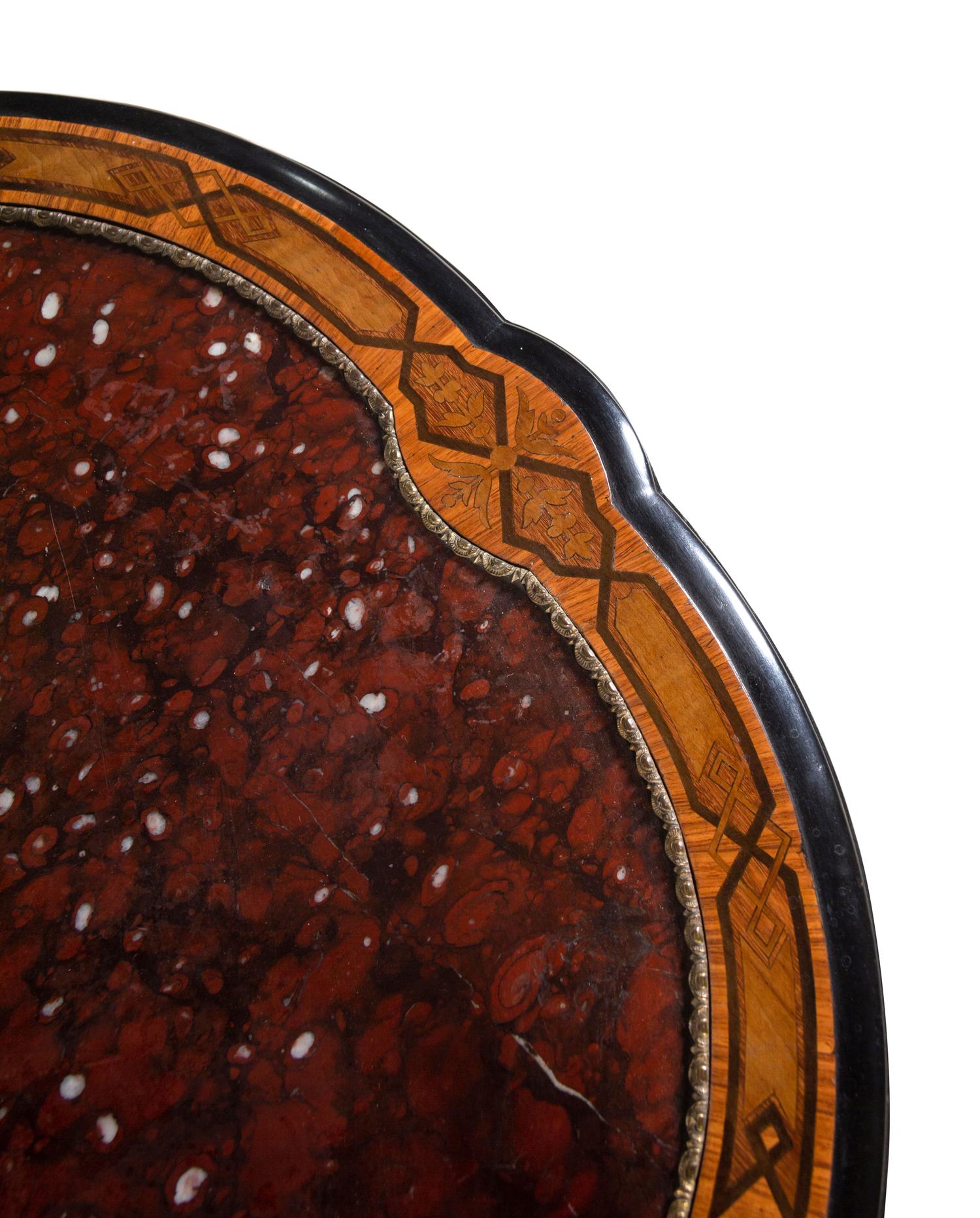 An Aesthetic Movement Parcel Ebonized Burl Walnut Marble-Top Center Table
