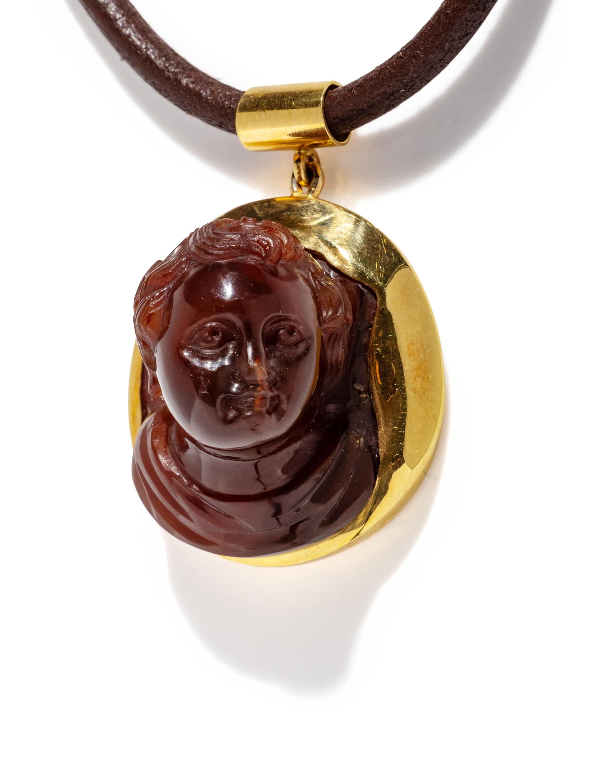 A Roman Carnelian Cameo of a Boy — Set in a gold pendant