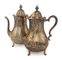 A Pair of Cartier Silver-Gilt Teapots