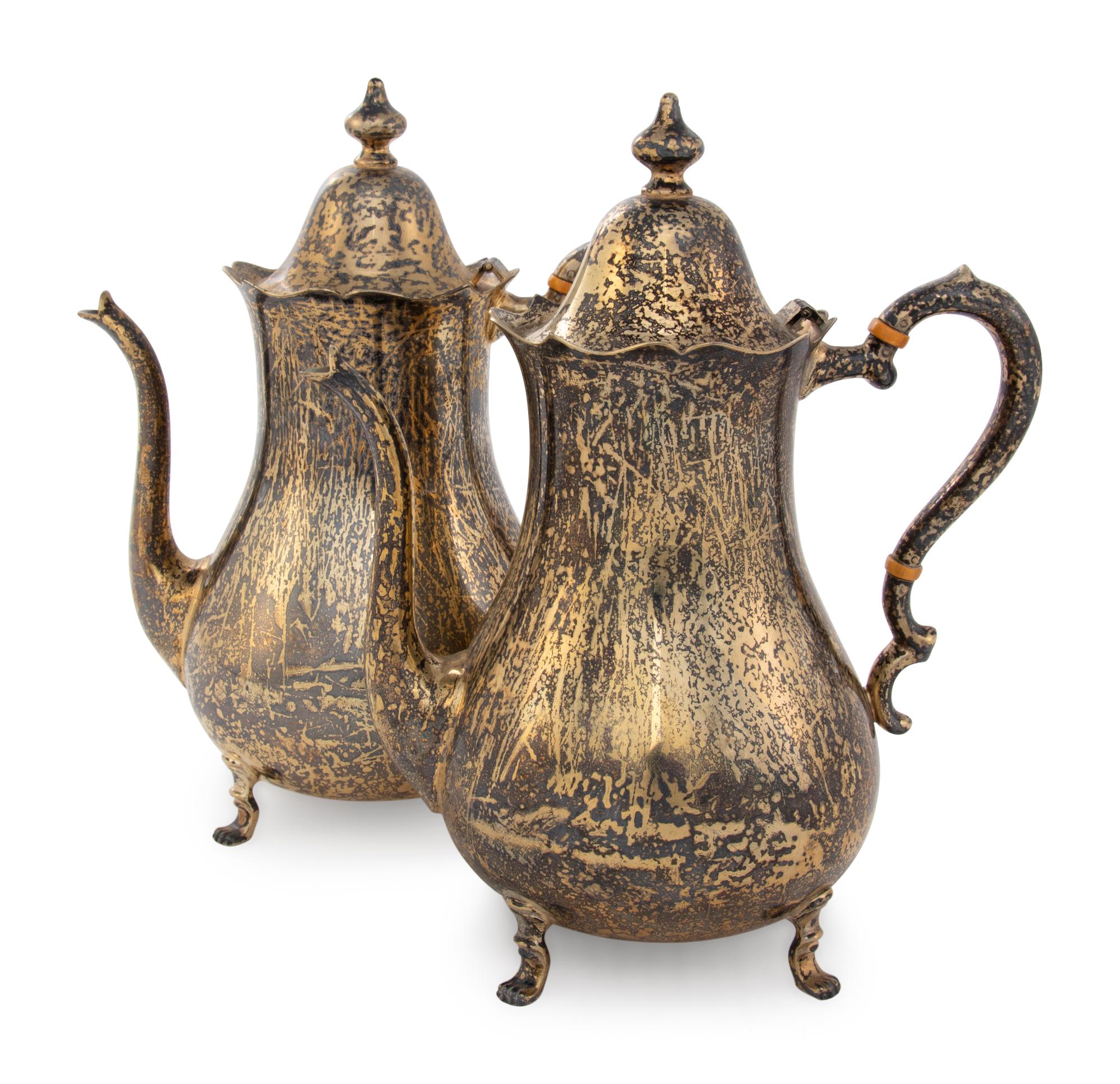 A Pair of Cartier Silver-Gilt Teapots