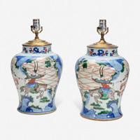 A pair of large Chinese wucai-decorated porcelain jars, mounted as lamps