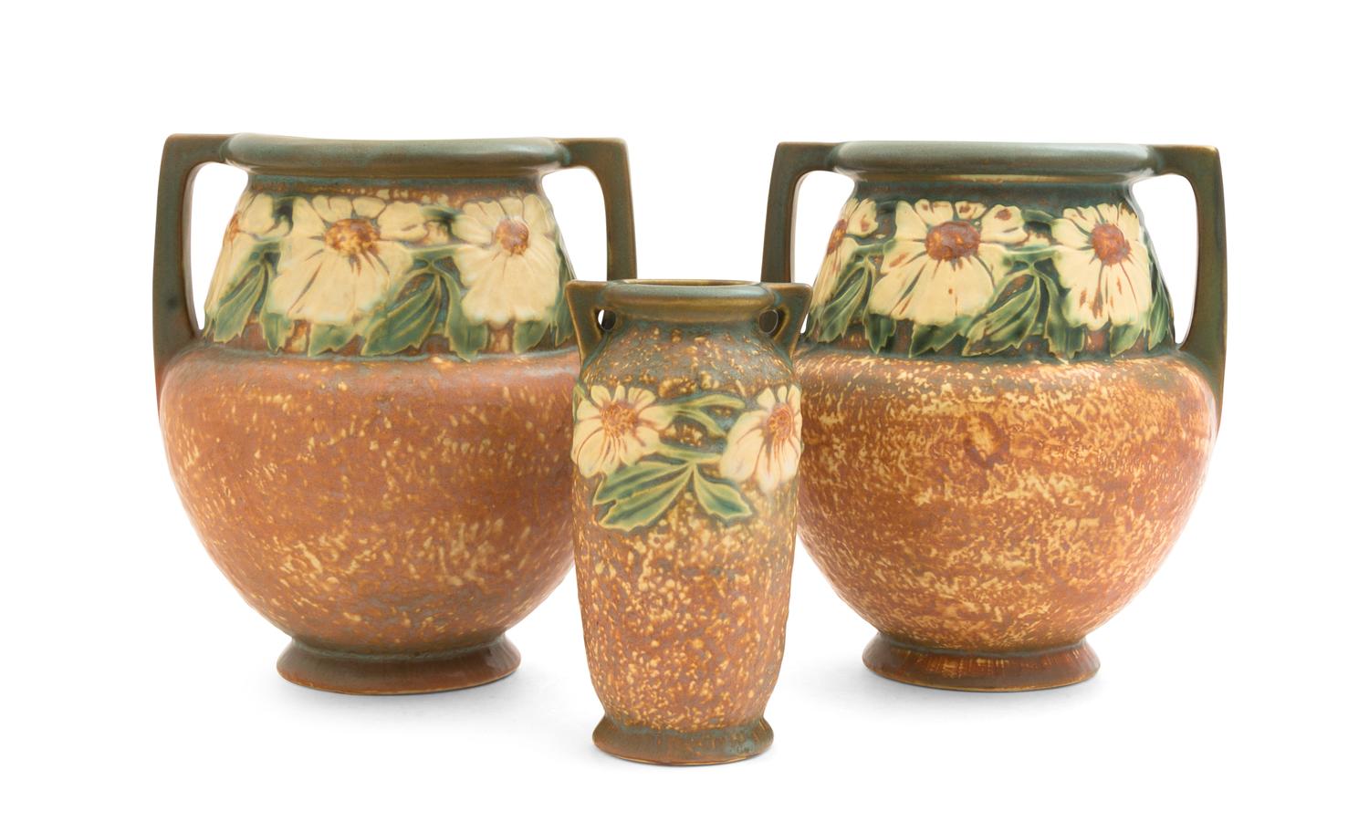 Three Roseville Dahlrose Pottery Vases Height of pair 8 inches, single 6 1/4 inches.