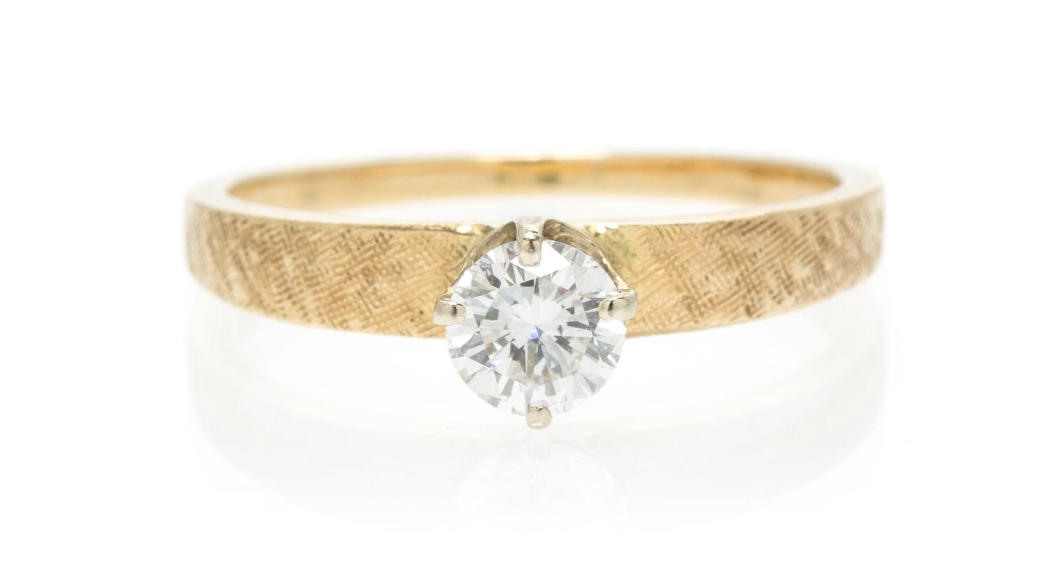A 14 Karat Yellow Gold and Diamond Solitaire Ring, Peacock, 1.70 dwts.
