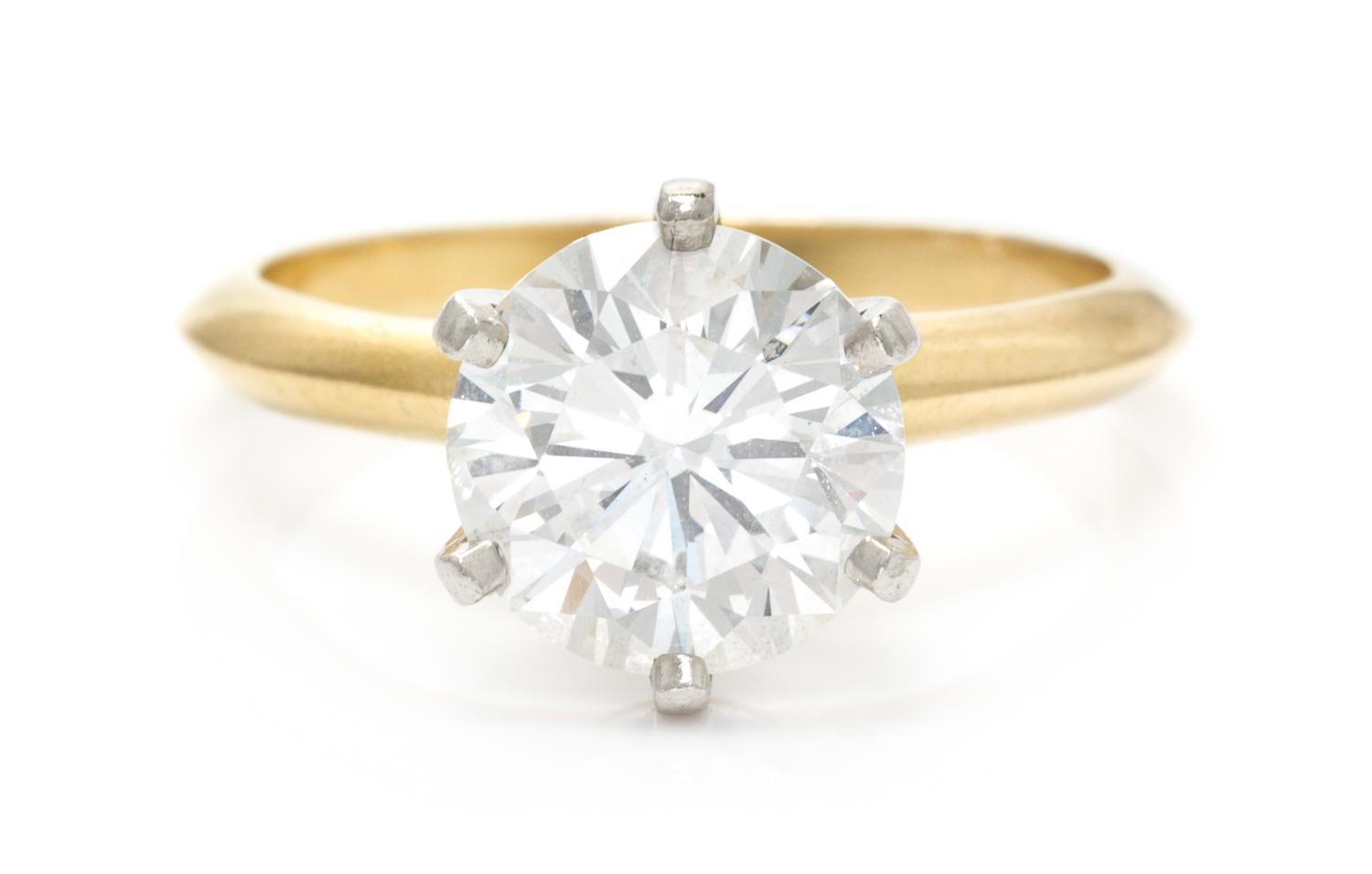 An 18 Karat Yellow Gold, Platinum and Diamond Solitaire Ring, Tiffany & Co., 2.60 dwts.