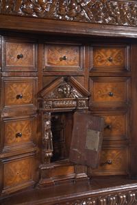 A Renaissance Revival Carved Walnut and Marquetry Collector's Cabinet