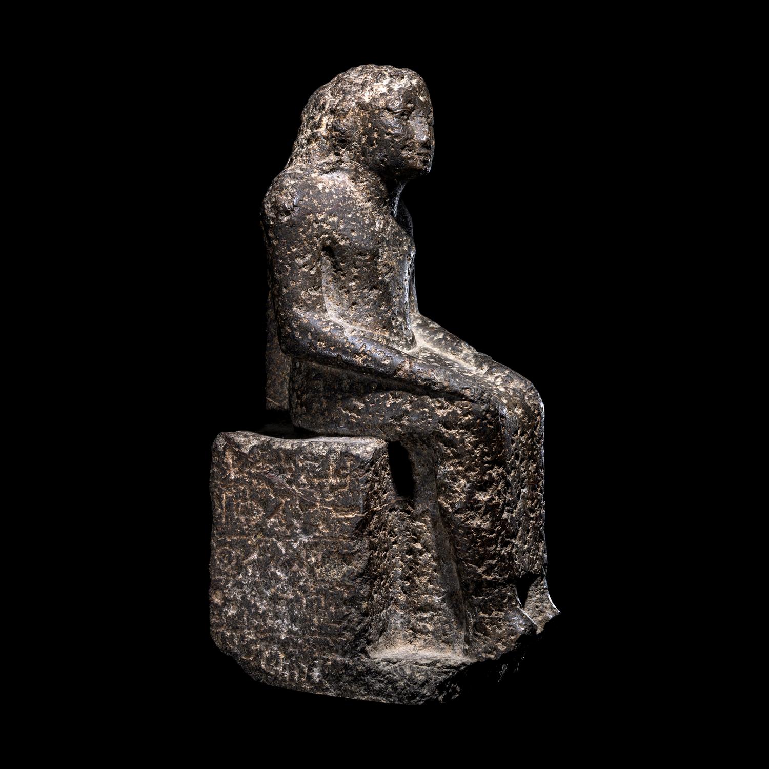 An Egyptian Diorite Seated Figure