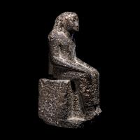 An Egyptian Diorite Seated Figure