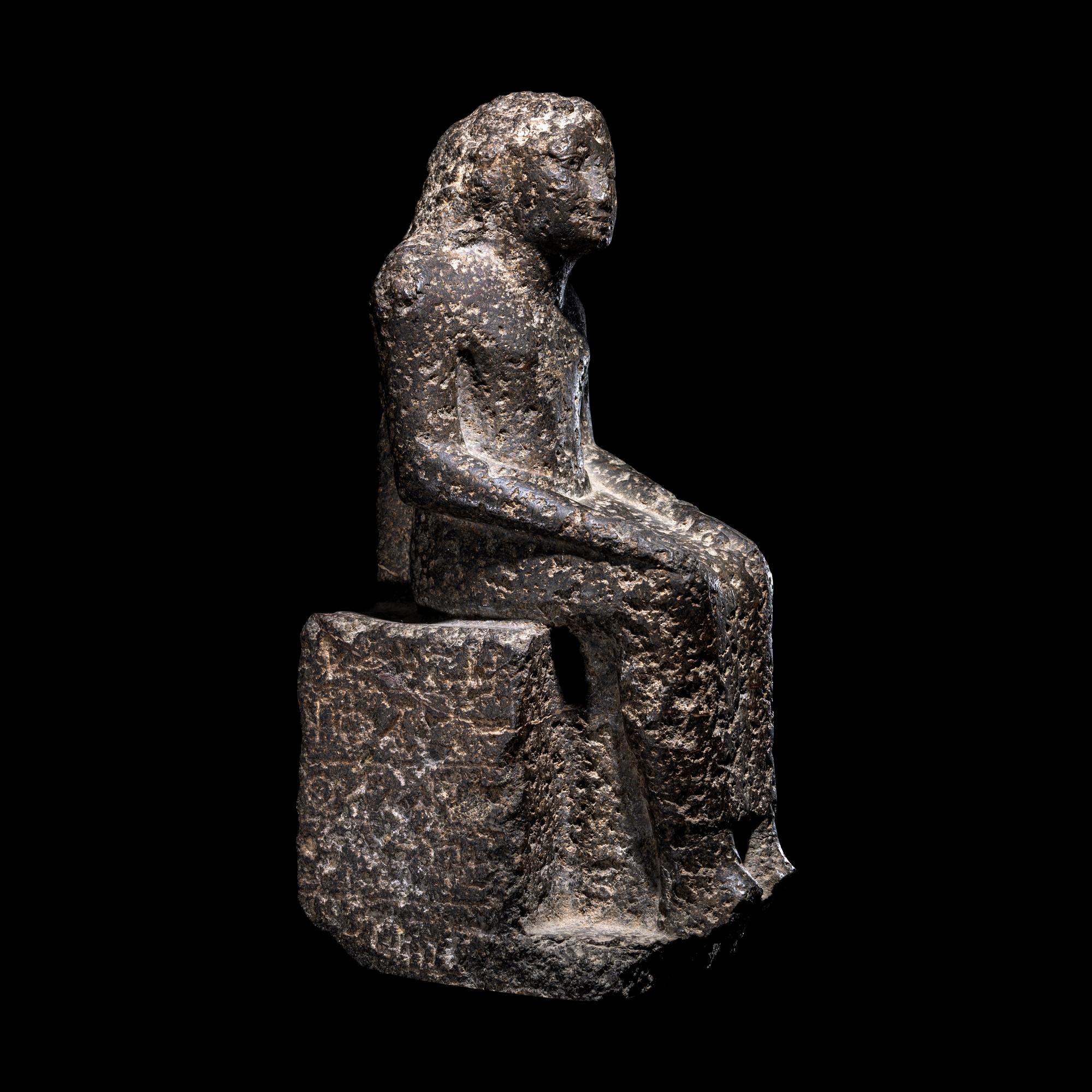 An Egyptian Diorite Seated Figure