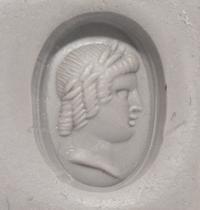A Roman Banded Agate Ring Stone with a Portrait Head of the God Apollo