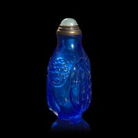 A Chinese Carved Sapphire Blue Glass "Archaistic Scrolls" Snuff Bottle