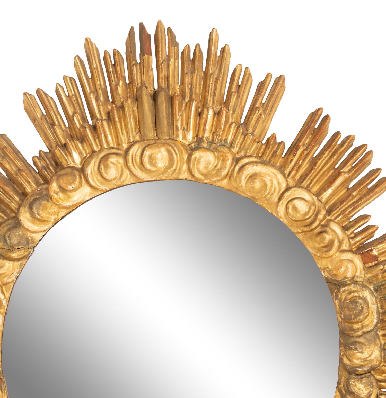 An Italian Carved Giltwood Sunburst and Cloud Framed Mirror