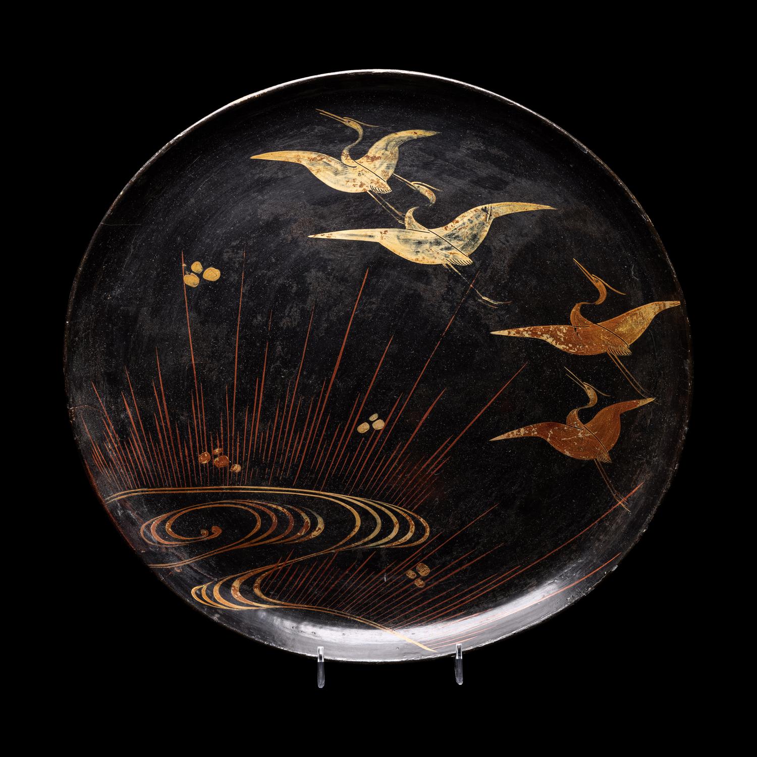 A Japanese Black Ground Gold and Red Lacquer Circular Dish