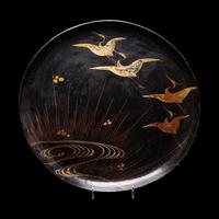 A Japanese Black Ground Gold and Red Lacquer Circular Dish