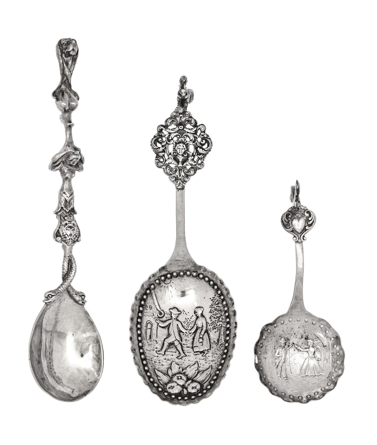 A Group of Three Dutch and English Silver Serving Spoons, 19th/20th century, comprising two Dutch and one English example, each having