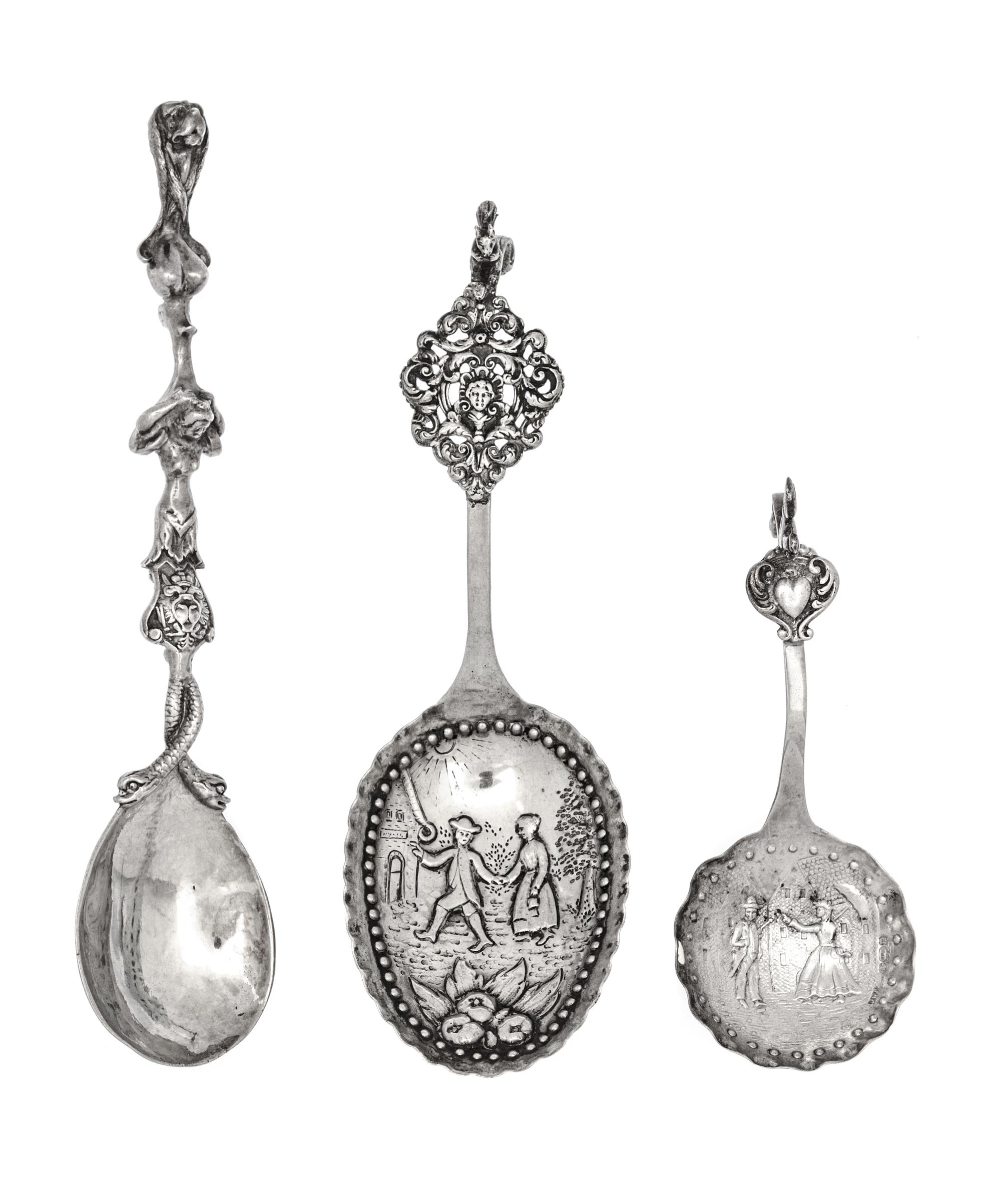 A Group of Three Dutch and English Silver Serving Spoons, 19th/20th century, comprising two Dutch and one English example, each having
