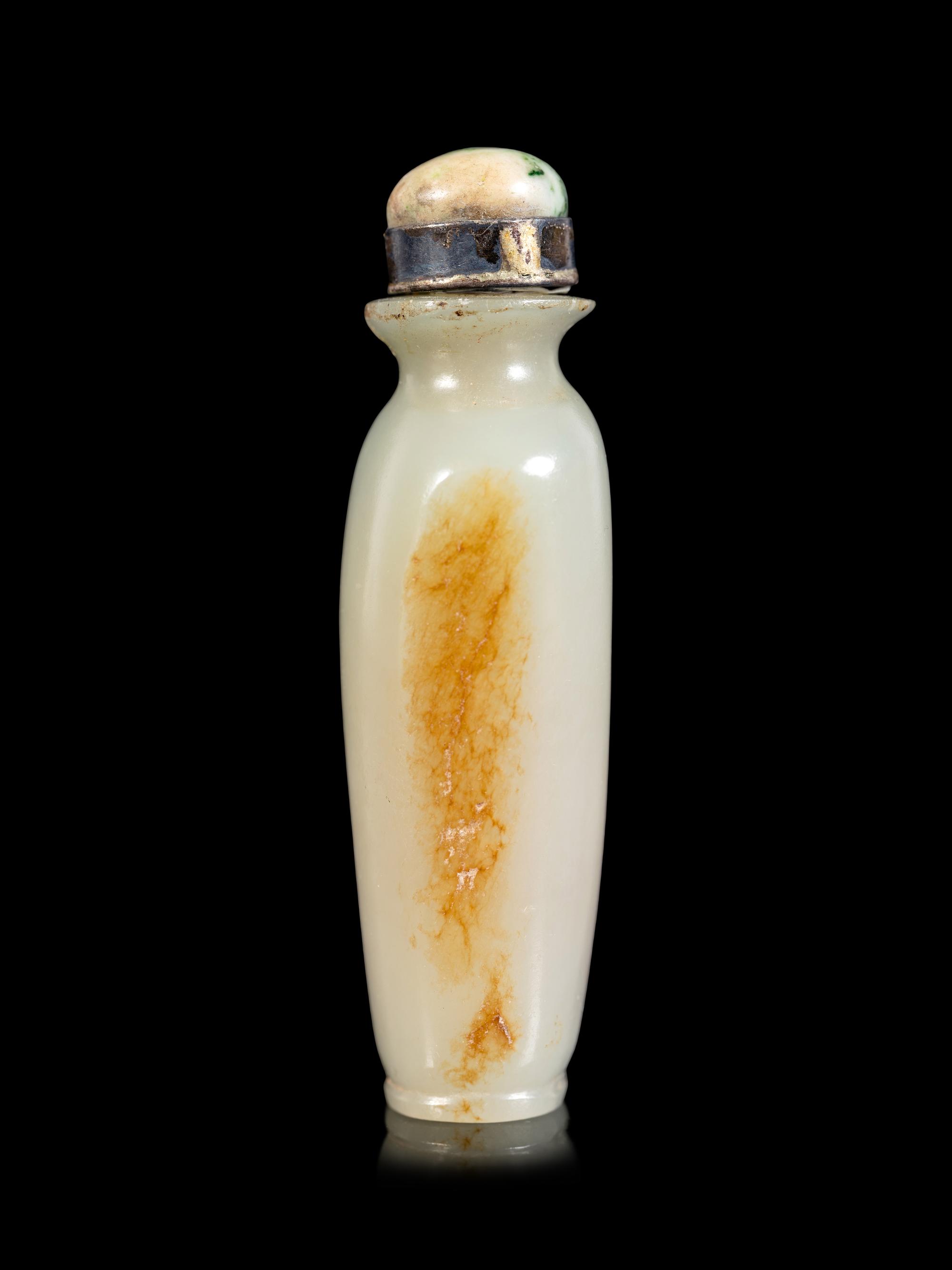 A Celadon and Russet Jade Snuff Bottle