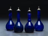 Four 'Mary Gregory' Cobalt Glass Barber Bottles