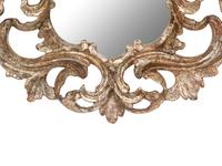 An Italian Baroque Style Silvered Wood Mirror
