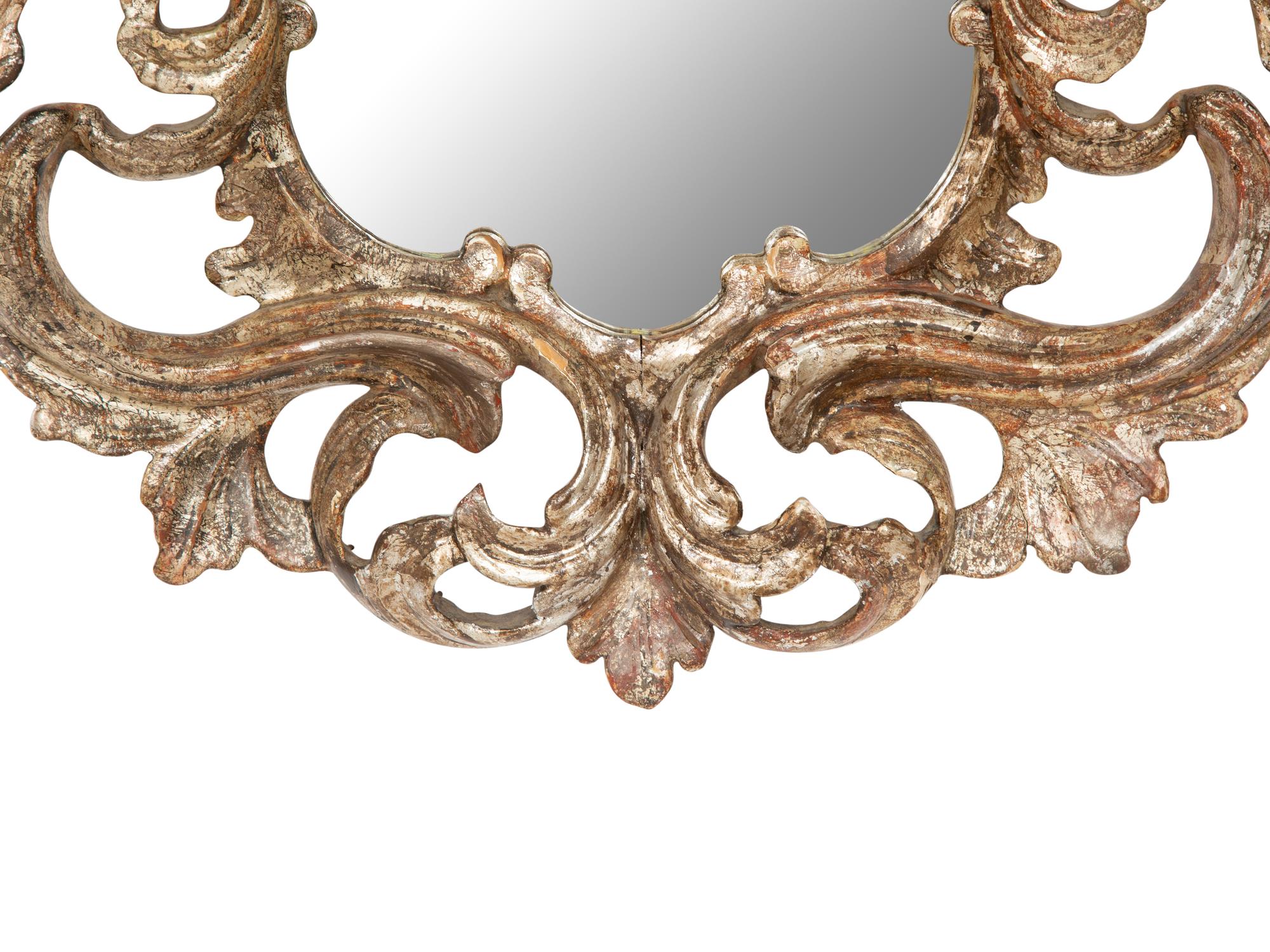 An Italian Baroque Style Silvered Wood Mirror