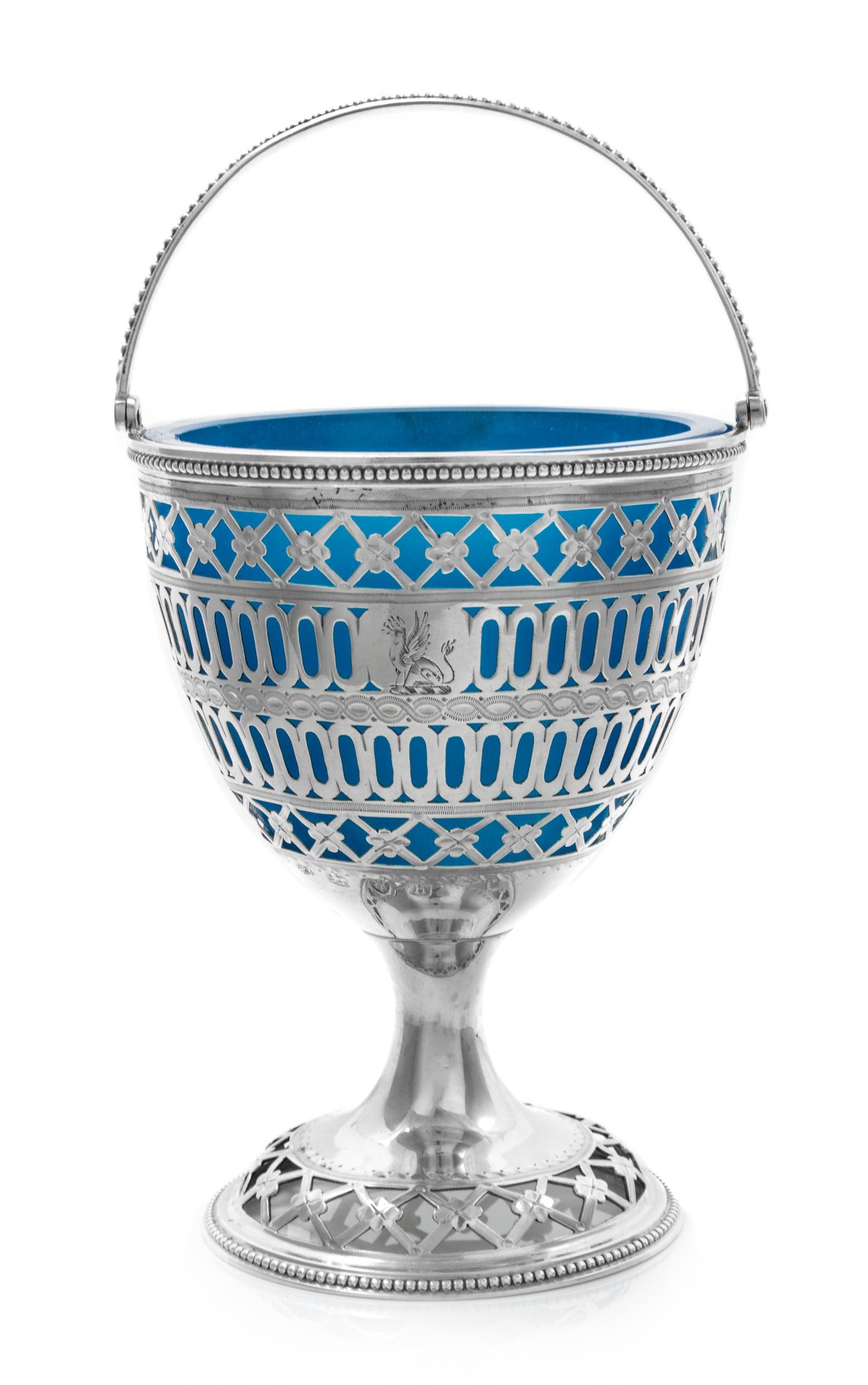 A George III Reticulated Silver Sugar Basket with Glass Liner, Hester Bateman, London, 1783, of ovoid form, having a beaded edge and a