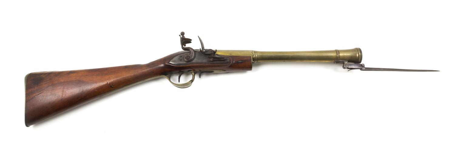 An English Walnut, Brass and Steel Flintlock Blunderbuss, Lacy & Co., Length overall 29 3/4 inches.