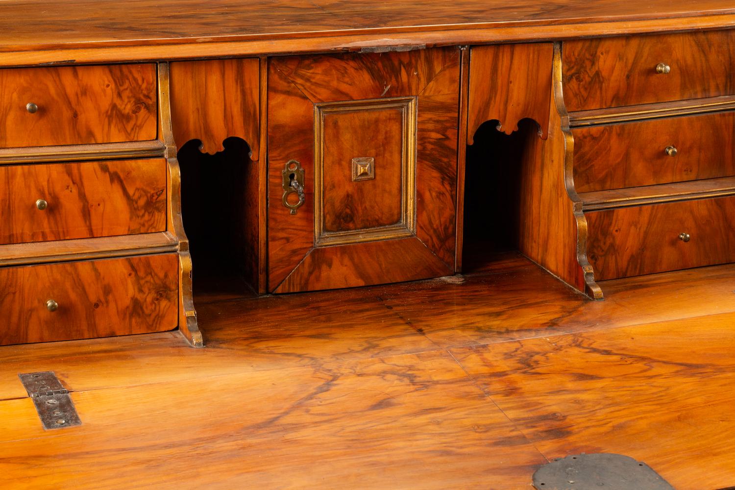 A Continental Parcel Gilt Walnut Slant-Front Bureau