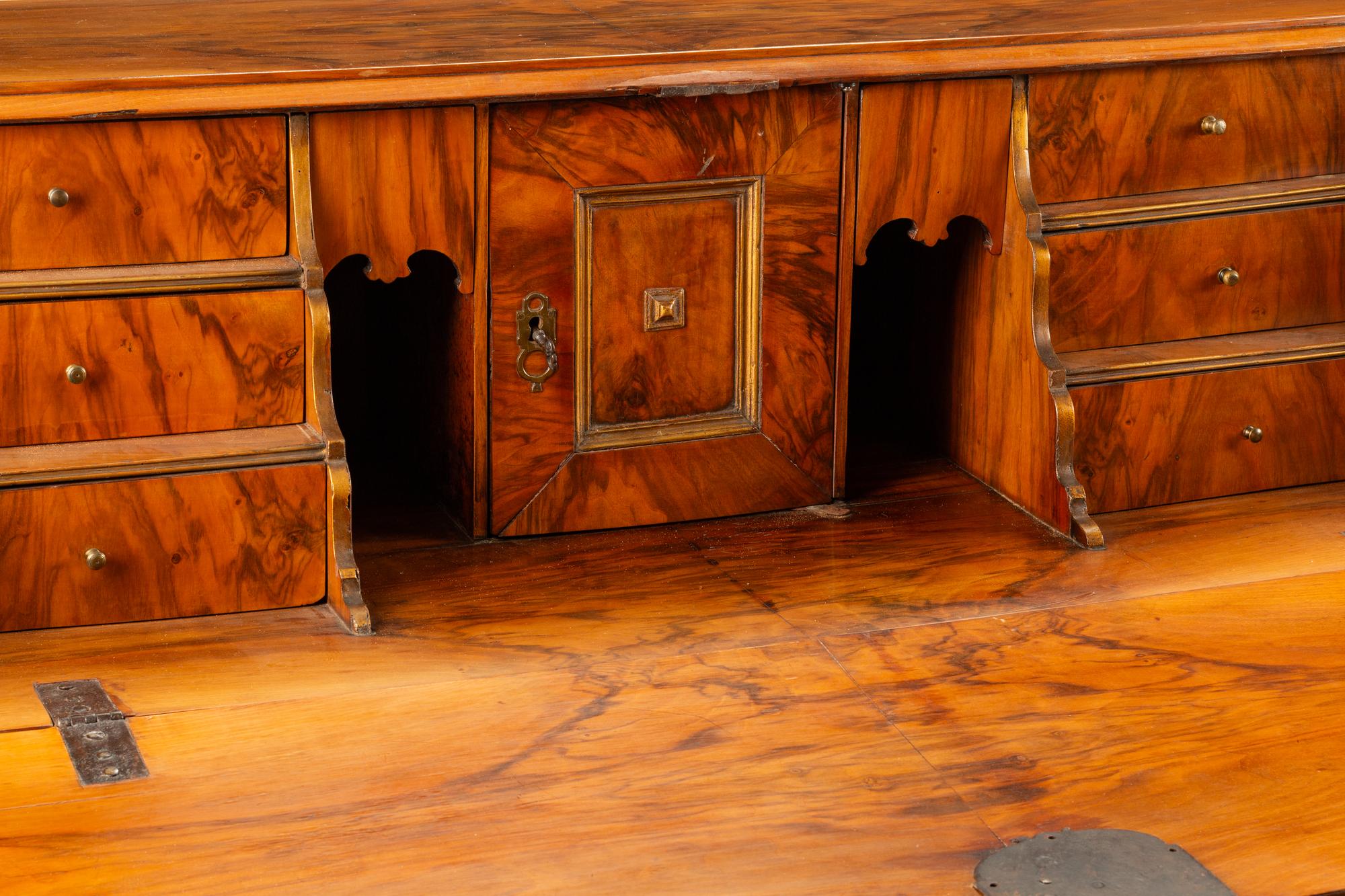A Continental Parcel Gilt Walnut Slant-Front Bureau