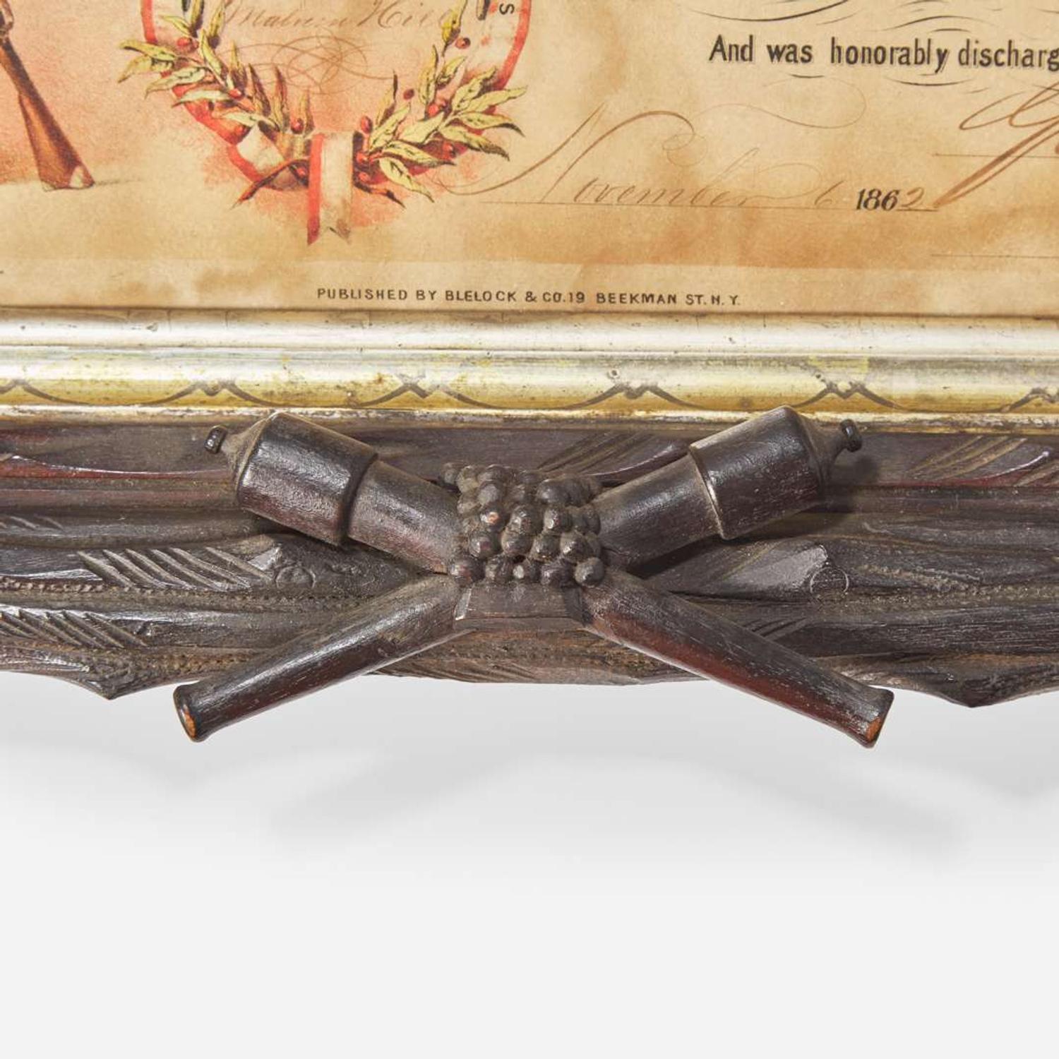 [CIVIL WAR]. Folk-art carved frame with discharge for Massachusetts soldier Charles Clark, ca 1865.