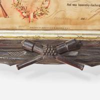 [CIVIL WAR]. Folk-art carved frame with discharge for Massachusetts soldier Charles Clark, ca 1865.