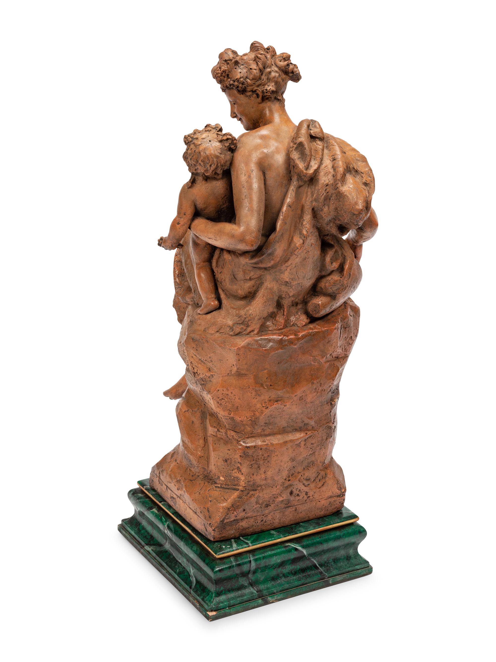 A Continental Terra Cotta Figural Group on a Faux Marble Base