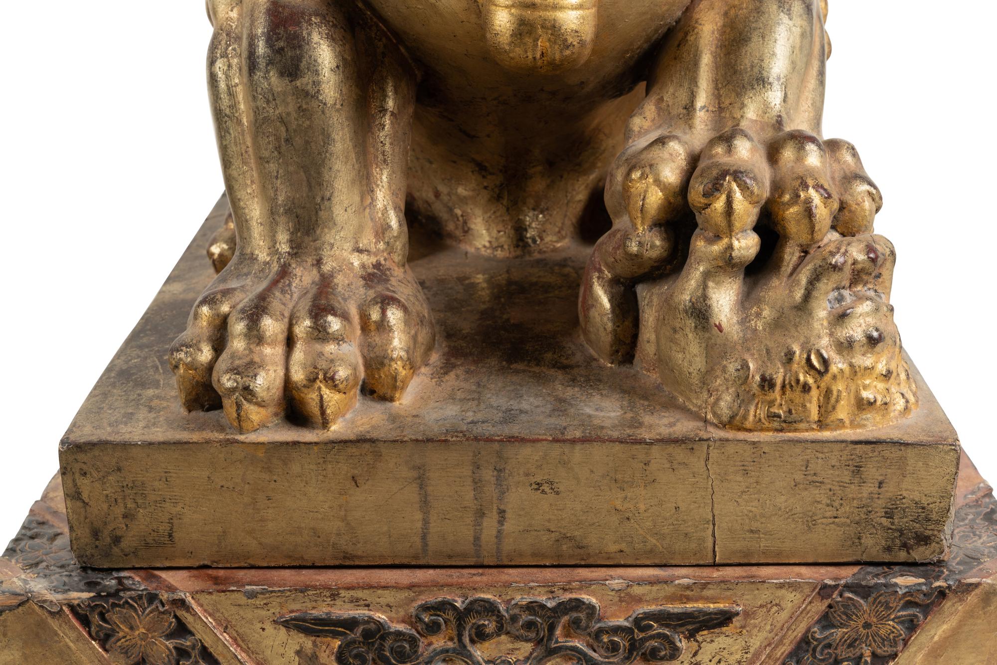 A Pair of Large Chinese Giltwood and Composition Buddhistic Lions