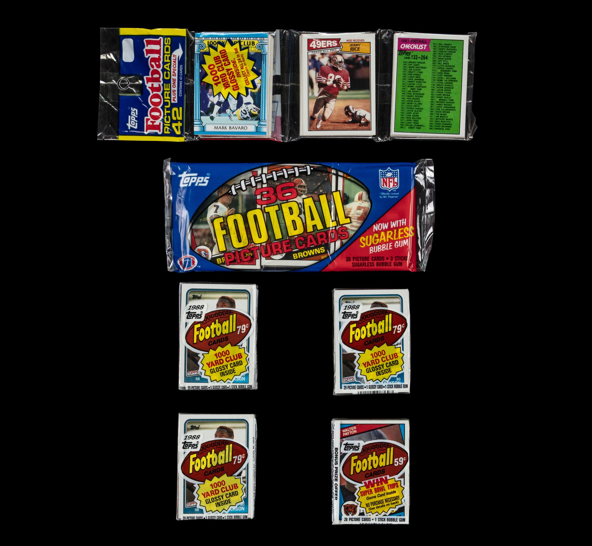 A Collection of 1980s Unopened Topps Football Card Packs Including John Elway Rookie
