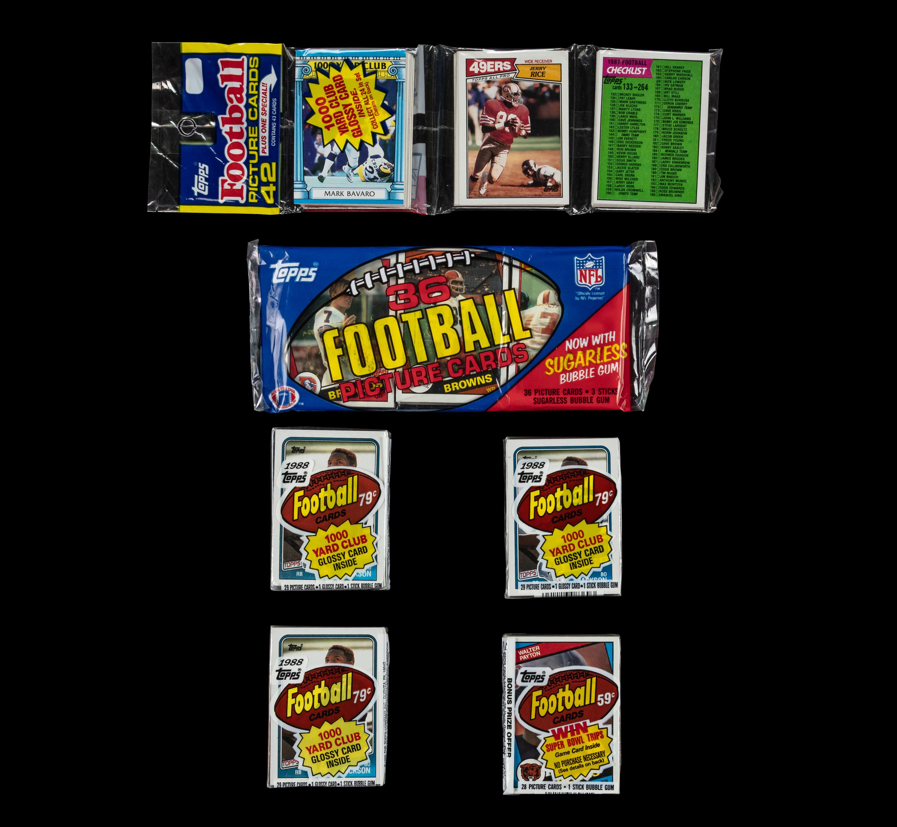 A Collection of 1980s Unopened Topps Football Card Packs Including John Elway Rookie
