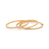 COLLECTION OF YELLOW GOLD BANGLE BRACELETS