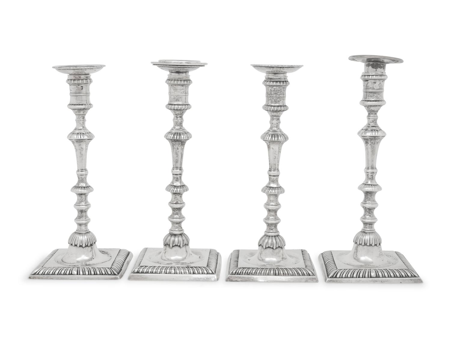 An Assembled Set of Four George III Silver Candlesticks