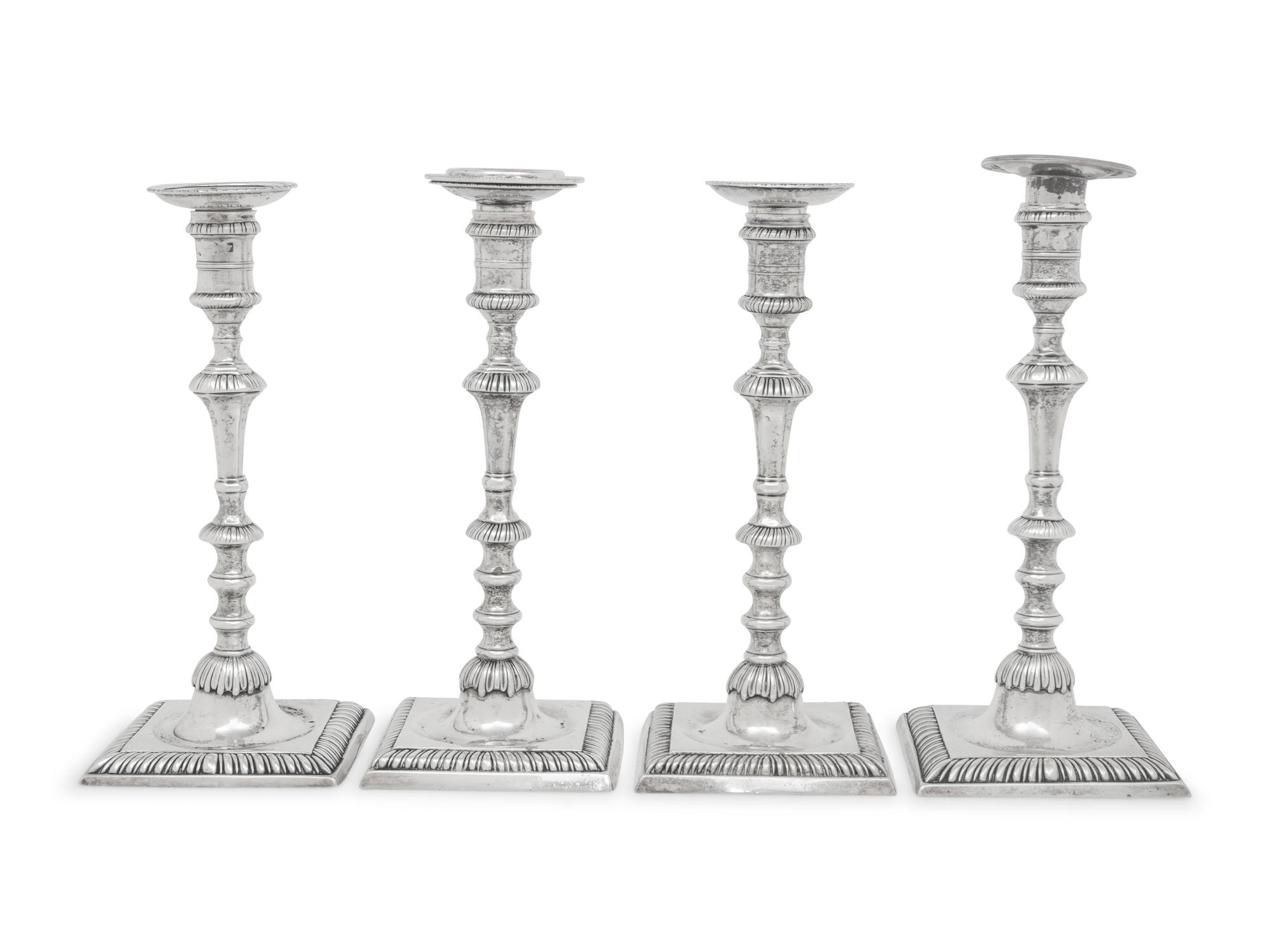 An Assembled Set of Four George III Silver Candlesticks