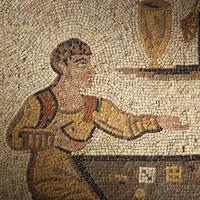 A Roman Style Stone Mosaic Panel with Men Playing a Dice Game