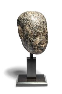An Egyptian Stone Head of a Priest