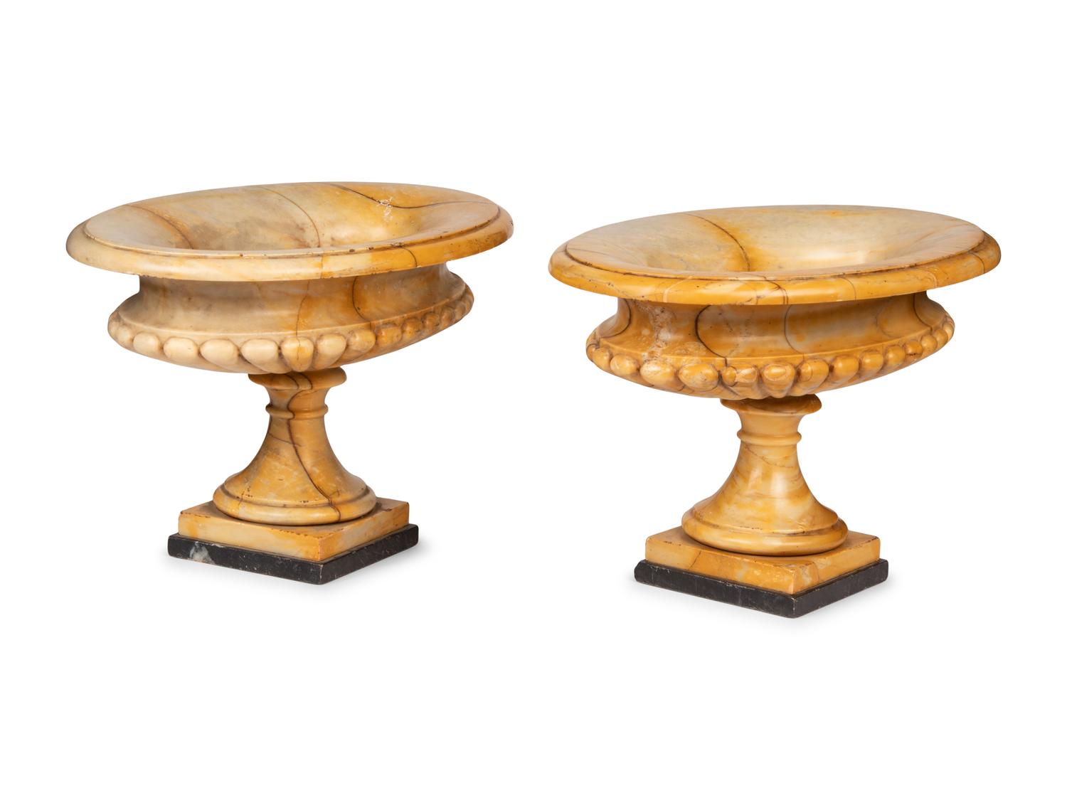 A Pair of Neoclassical Style Gadrooned Sienna Marble Urns