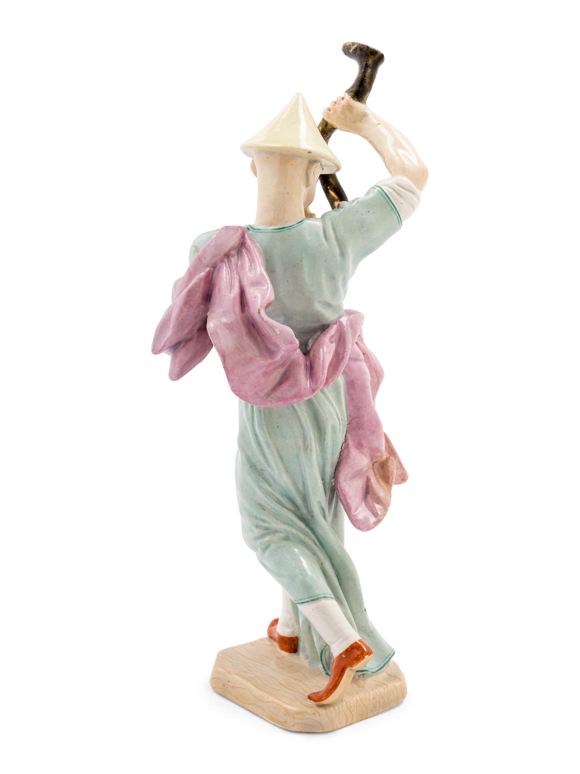 A Hochst Porcelain Figure of a Chinese Trumpeter