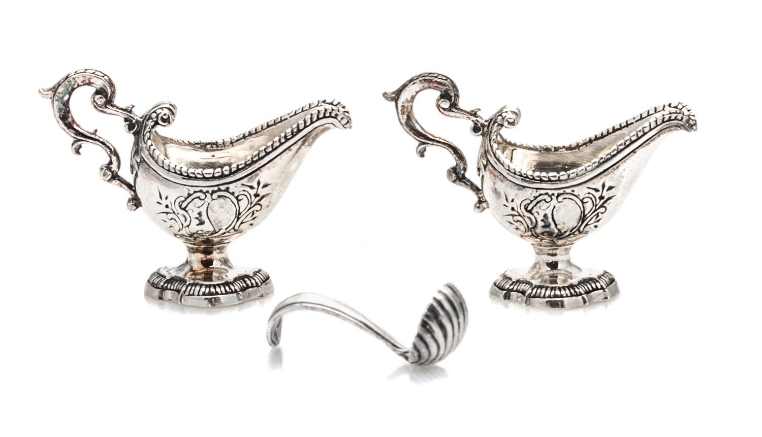 A Pair of American Silver Sauce Boats, Obadiah Fisher, New York, NY, each having a beaded rim and a scrolled handle, the body with an e