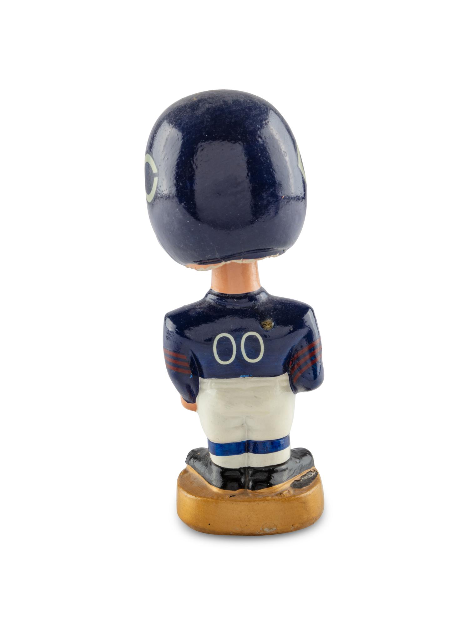 A Group of Seven Vintage NFL Bobblehead Nodder Figures