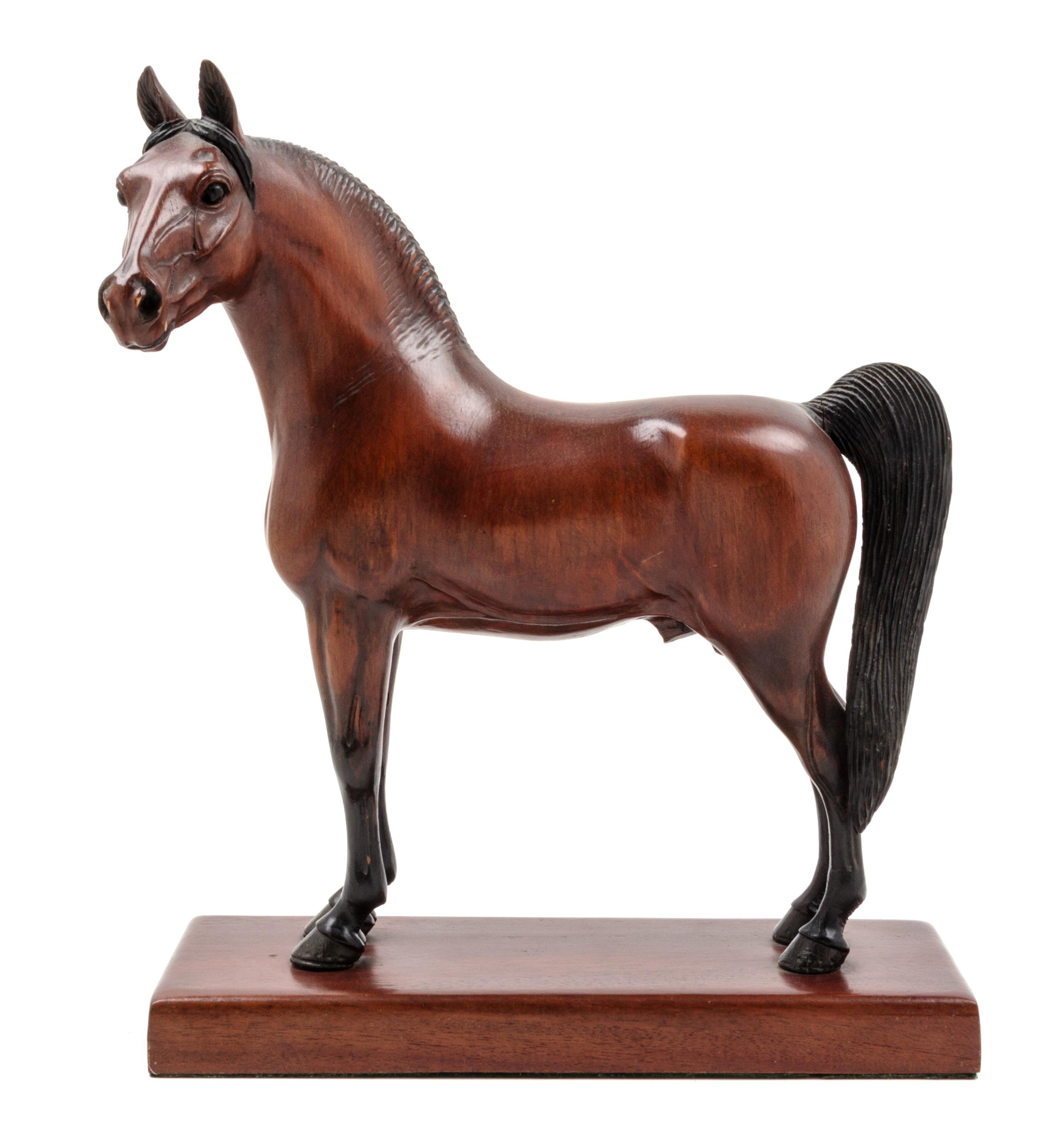 A Carved and Painted Wood Figure of a Thoroughbred Horse Height 13 inches. — PETER GIBA, 20TH CENTURY