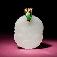A Chinese White Jade 'Floral' Pendant, 18th/19th Century — 清中期 白玉花卉紋牌